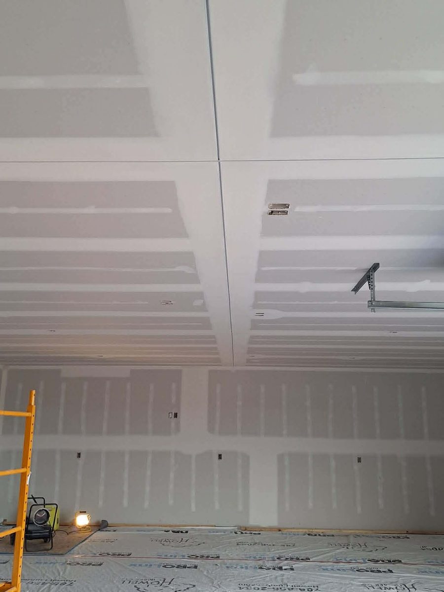 Garage walls and ceiling with drywall finishing in progress