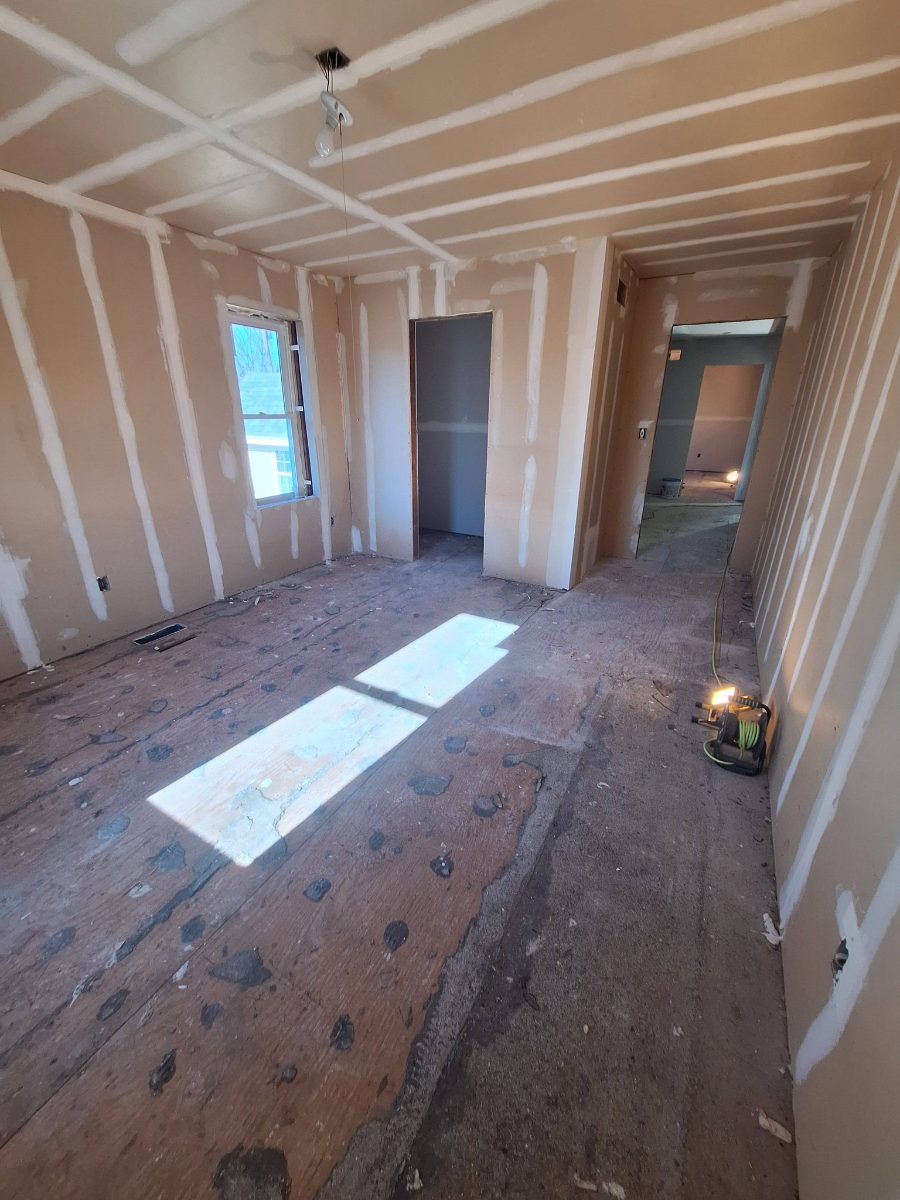 Drywall seams and ceiling finish in a room under construction