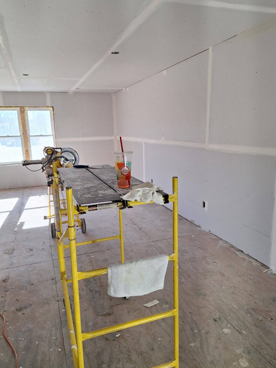 Drywall work around a hallway and room entry