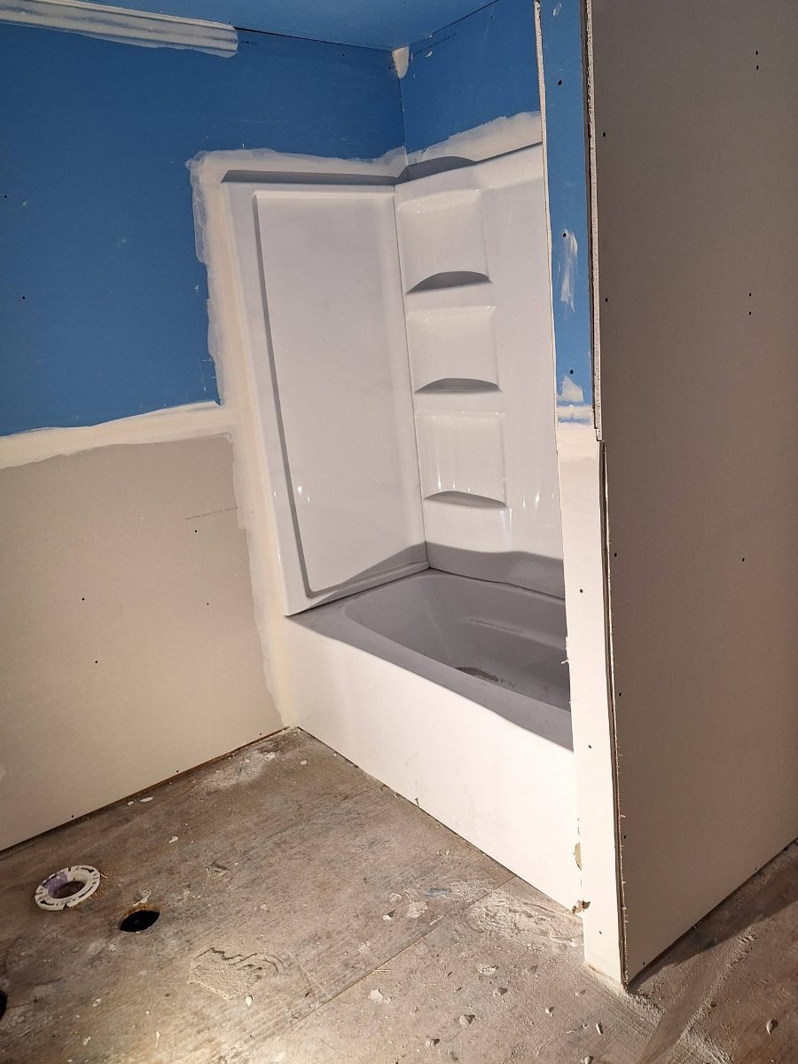 Drywall work around a new bathtub shower combo